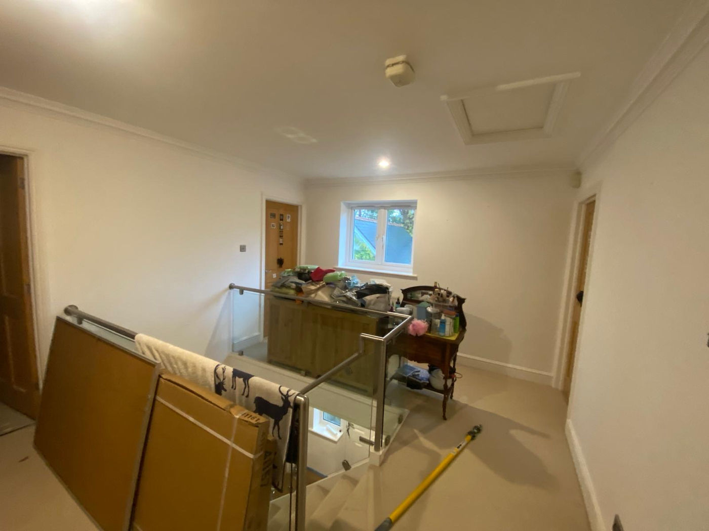 Bedroom being prepared for repair and decorating with materials in the room
