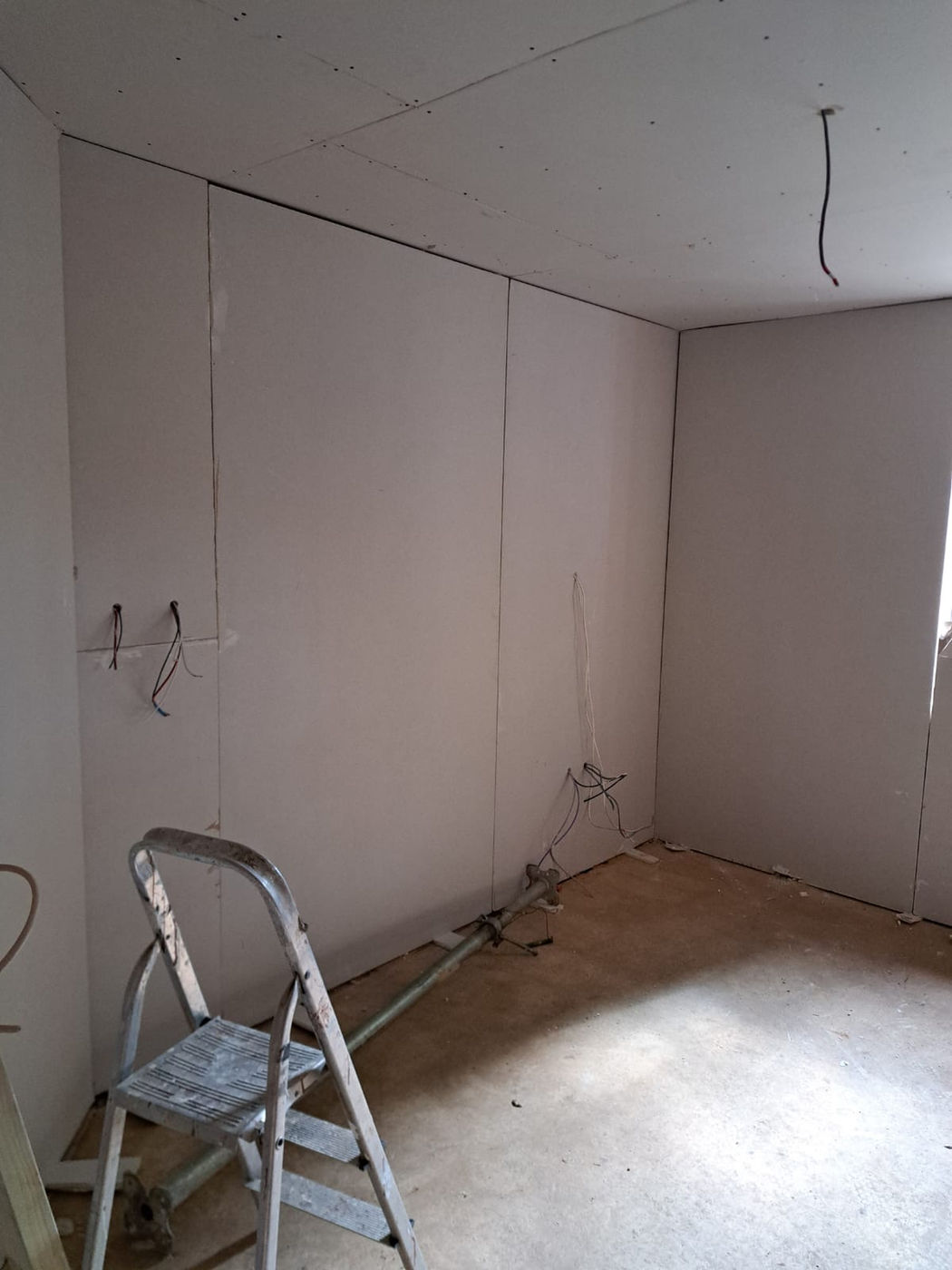 Wall and ceiling preparation with marked fixing points before finishing